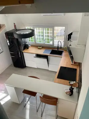 a kitchen with a white counter and a sink at Brando Apartment II in Rome
