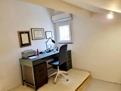 an office with a desk and a chair at Brando Apartment II in Rome