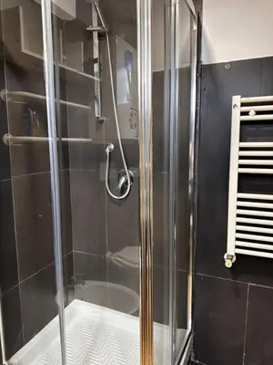 a shower with a glass door in a bathroom at Casa Marlon Pietralata in Rome