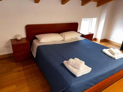 a bedroom with a bed with two towels on it at Casa Marlon Pietralata in Rome