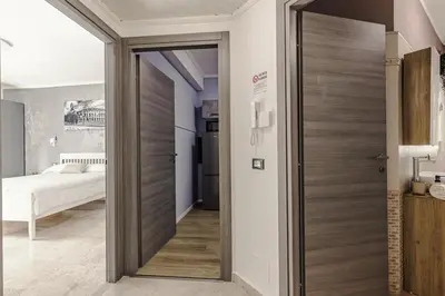 a room with a door leading to a bedroom at La Bellavita Trastevere in Rome