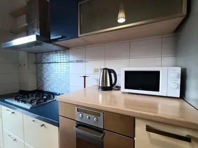 a kitchen with a counter top with a microwave at Domus Marco Aurelio in Rome