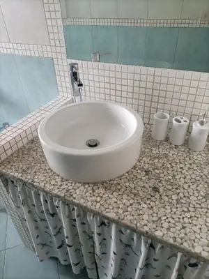 a white sink on a counter in a bathroom at Domus Marco Aurelio in Rome
