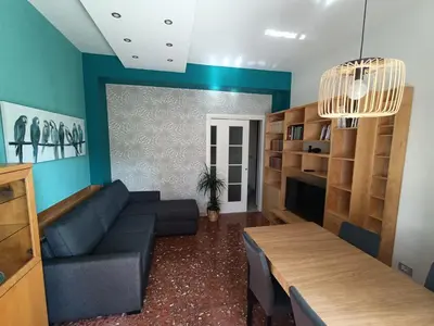 a living room with a couch and a table at Domus Marco Aurelio in Rome