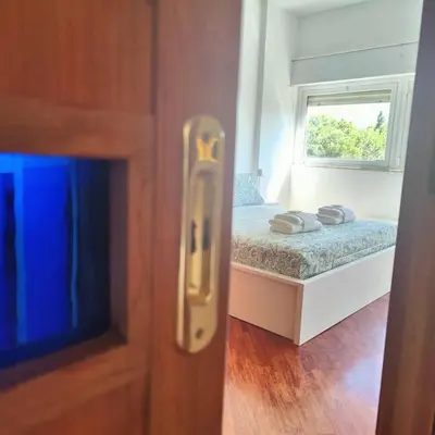 a small bedroom with a bed and a window at Culla di Diego BOX auto, Sospesi nel Cielo! in Rome