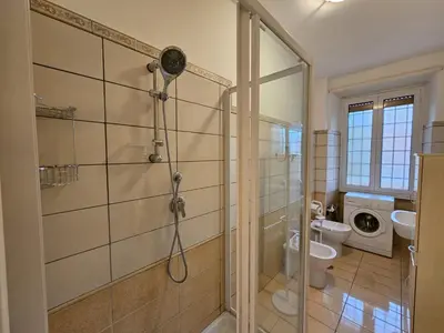 a bathroom with a shower and a toilet at Be Your Home - Isabella Bright Apartment in Rome