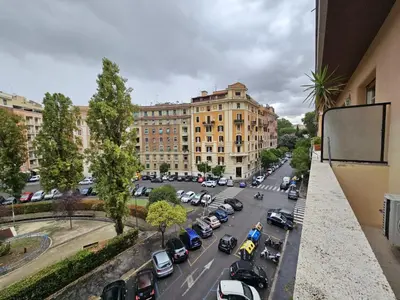 an overhead view of a city street with cars parked at Be Your Home - Isabella Bright Apartment in Rome