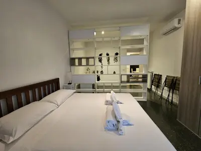 a bedroom with a large white bed with towels on it at Be Your Home - Isabella Bright Apartment in Rome