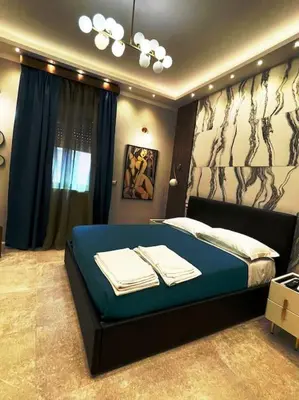 a bedroom with a bed with towels on it at 2Effe apartment in Rome