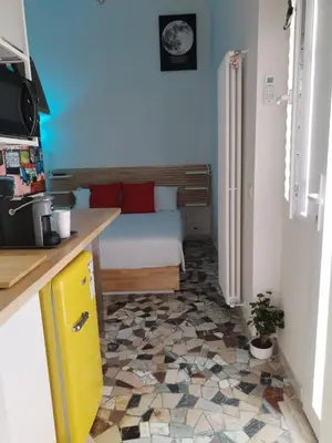 a bedroom with a bed and a tiled floor at Stanza Del Principe in Rome