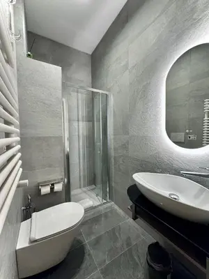 a bathroom with a sink and a toilet and a tub at Domus house in Rome