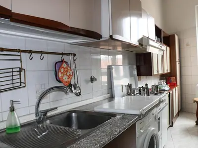a kitchen with a sink and a dishwasher at Casa Vacanze Scalone in Rome