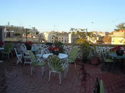 a group of tables and chairs on a patio at Casa Vacanze Scalone in Rome