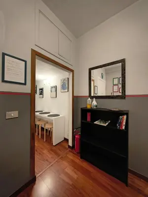 a room with a table and a mirror and a dining room at Gregory B&B Vatican in Rome