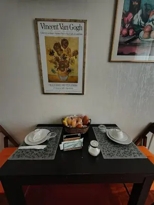 a black table with a bowl of fruit on it at Gregory B&B Vatican in Rome