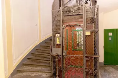 an entrance to a room with a metal gate at Tiny Steps to Piazza di Spagna in Rome