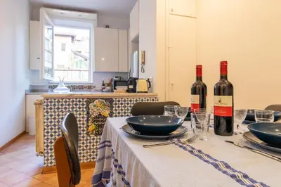 a table with two bottles of wine on it at Terrazza Minerva in Rome