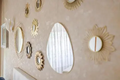 a room with mirrors on the wall with a sink at Royal Vatican house JND in Rome