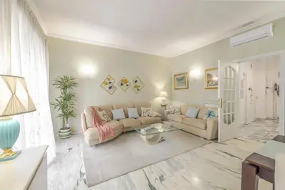 a living room with a couch and a table at Royal Vatican house JND in Rome