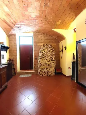 a large room with a brick wall and a door at San Giovanni Loft in Rome