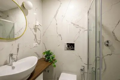 a bathroom with a sink and a shower at Remember Vatican Apartment in Rome