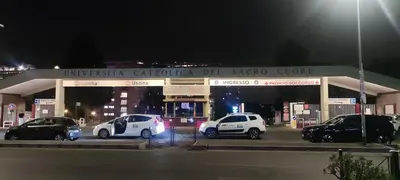 a gas station with cars parked in a parking lot at Gemelli BnB Guest House in Rome