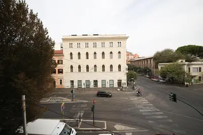 a large white building on a city street at Rafael House by GHOR in Rome