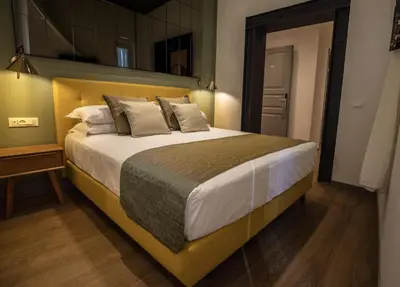 a bedroom with a large bed in a room at Trevi Monti House in Rome