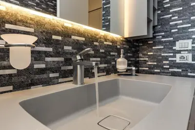 a kitchen sink with a faucet on a counter at Belli Vatican Attico - Luxury Design Rooftop Apartment close to Vatican City in Rome