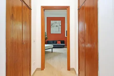 a hallway with a door leading into a living room at MAYA - Boutique Apartment in Rome