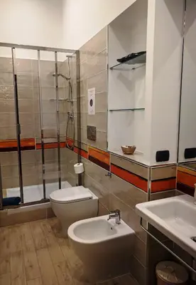 a bathroom with a toilet and a shower and a sink at L'Ottavo Re di Roma in Rome