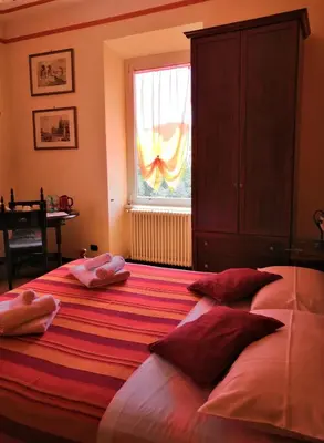 a bedroom with a large bed with towels on it at L'Ottavo Re di Roma in Rome