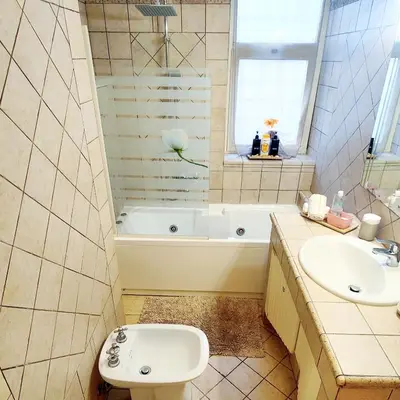 a bathroom with a sink and a tub and a toilet at Roma For You - Apartment - Metro B in Rome