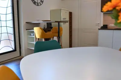 a kitchen with a table and chairs in a room at D&D Ardeatino Appia Antica in Rome