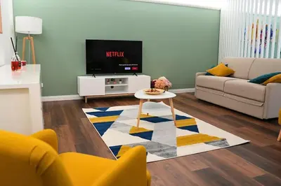 a living room with a couch and a tv at D&D Ardeatino Appia Antica in Rome