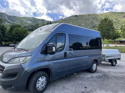 a blue van parked in a parking lot at D&D Ardeatino Appia Antica in Rome