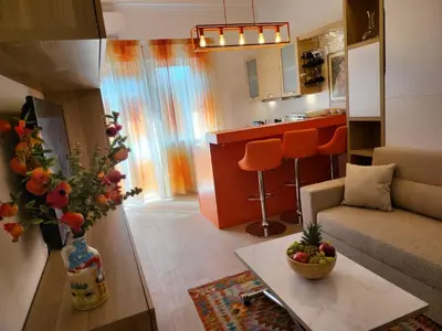 a living room with a couch and a table at Venus Inn Casa Vacanze AURELIA ANTICA in Rome
