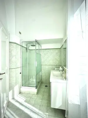 a bathroom with a glass shower and a sink at èROMA - SANTA MARIA MAGGIORE BASILICA Apartment in Rome