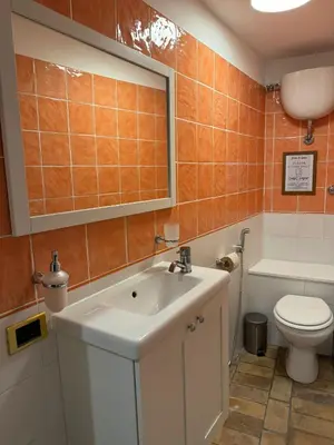 a bathroom with a sink and a toilet and a tub at èROMA - SANTA MARIA MAGGIORE BASILICA Apartment in Rome