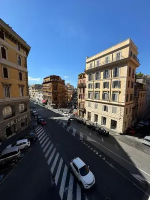 a city street with cars parked on the street at èROMA - SANTA MARIA MAGGIORE BASILICA Apartment in Rome
