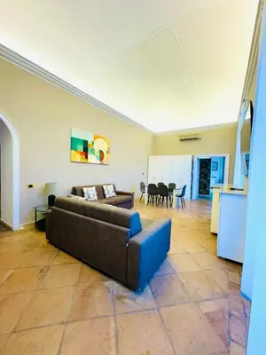 a living room with a couch and a table at èROMA - SANTA MARIA MAGGIORE BASILICA Apartment in Rome