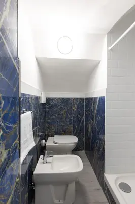 a kitchen with a washer and dryer in a room at Royal House Pigneto in Rome