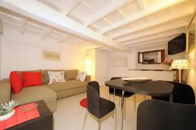 a living room with a couch and a table at PANTHEON APARTMENT in the Heart of Rome in Rome