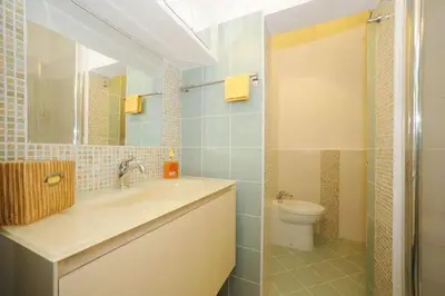 a bathroom with a sink and a toilet at PANTHEON APARTMENT in the Heart of Rome in Rome