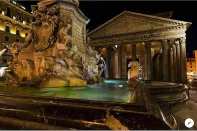 a large fountain in front of a building at PANTHEON APARTMENT in the Heart of Rome in Rome