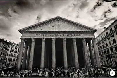 a black and white photo of a large building with columns at PANTHEON APARTMENT in the Heart of Rome in Rome