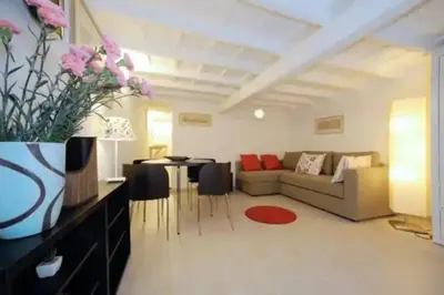 a living room with a couch and a table at PANTHEON APARTMENT in the Heart of Rome in Rome