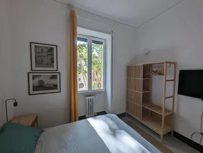 a bedroom with a bed and a window at Appartamento della Vittoria in Rome