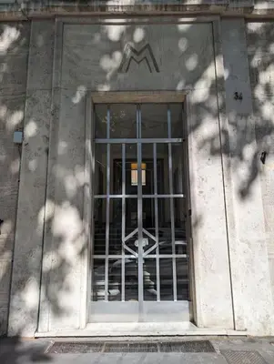 a door with a metal gate in a building at Appartamento della Vittoria in Rome