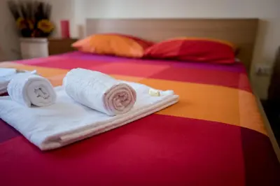 a pile of towels on a table in a bathroom at A Place Apart in Rome